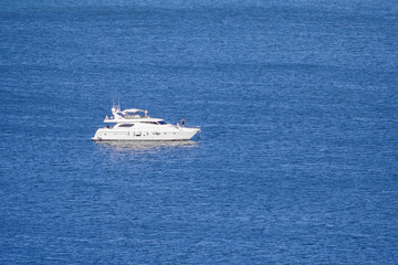 Fototapeta na wymiar Private motor yacht on the blue sea (copy space)