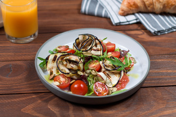 Grilled eggplant salad, tomatoes, lettuce with olive oil and red balsamic, sea salt and pink pepper. Vegan health food