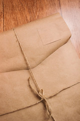 Top view blank book brown cover paper, earphone, and wood pencil in holder on white desk background