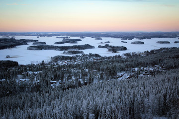Amazing panoramic landscape of winter pine forest from top of Puijo Tower, Kuopio, Finland