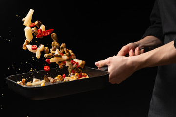 Professional chef prepares seafood with hot chili peppers. octopus kalmar mussels. Sea food. Asian and Oriental cuisine, Mexican spicy. Culinary background. Freezing food close up © Anton