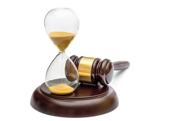 Judge's gavel with hourglass on white.