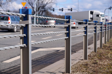 Close-up of steel ropes. Cable barrier, also called guard cable or wire road safety barrier, is increasingly used road safety.
