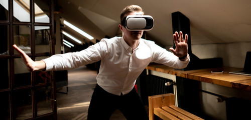 amazed office worker use electronic vr glasses