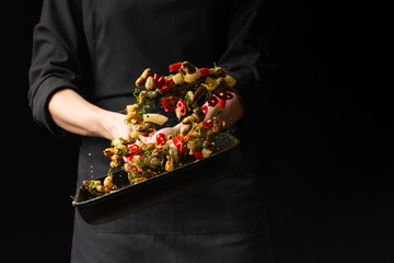 Professional chef prepares seafood with spicy chili peppers and greens. octopus kalmar mussels. Sea food. Asian and Oriental cuisine, Mexican spicy. Culinary background. Freezing food © Anton