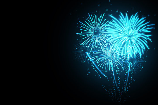 Beautiful festive blue fireworks on black background