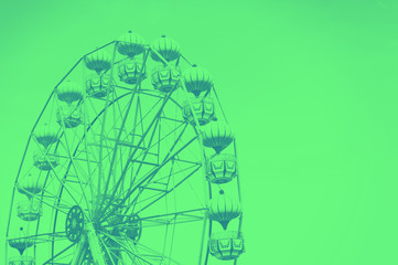 Ferris wheel on the green background