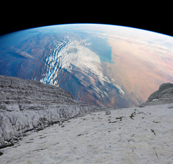 View of the world from a near Earth asteroid. Elements of this image furnished by NASA.