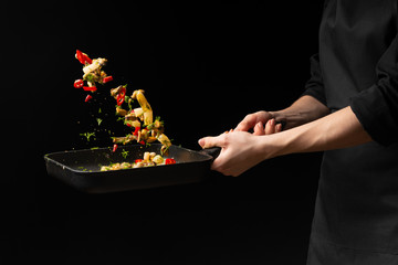 Professional chef prepares seafood with spicy chili peppers and greens. octopus kalmar mussels. Sea food. Asian and Oriental cuisine, Mexican spicy. Culinary background. Freezing food close up © Anton