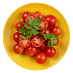 Tomatoes in a yellow plate on a white isolated background.