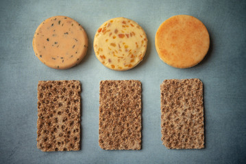 Cheese and crackers on a blue background 