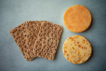 Cheese and crackers on a blue background 