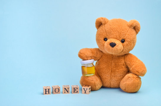 Teddy Bear Holding Honey Pot