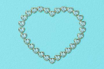 Heart-shaped frame made of small heart cut diamonds in yellow gold settings on turquoise textured background