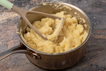 Creamy mashed potato in saucepan