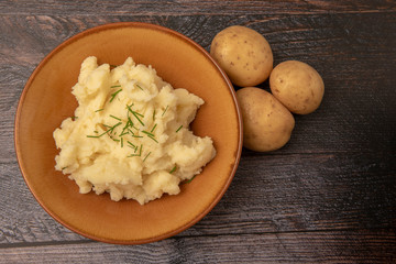 Mash potato on wooden background 