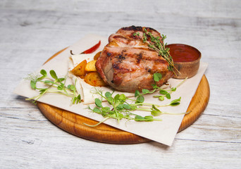 fried pork with ketchup potatoes and radish sprouts