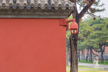Hide Security camera on the red wall,garnished CCTV camera in Forbidden City, China