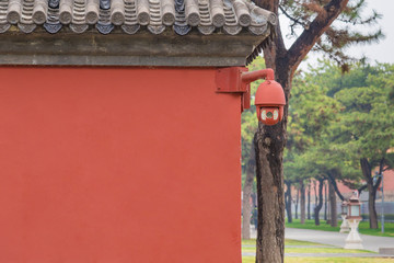 Obraz premium Hide Security camera on the red wall,garnished CCTV camera in Forbidden City, China