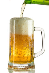 Pouring light beer in a beer mug, it turns out foam and spray