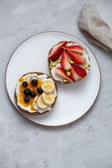 Fruit sandwiches with vegan ricotta cheese on marble background. view from above with copy space