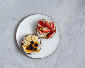 Fruit sandwiches with vegan ricotta cheese on marble background. view from above with copy space