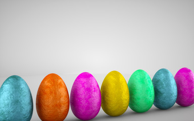 Chocolate easter eggs wrapped in colorful aluminum foil on white background. Delicious chocolate...