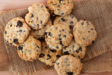 Pile of chocolate chip cookies on wooden desk,Top view.