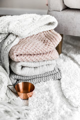 Still life details of room. A cup of coffee near the bed.