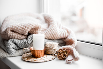 Still life details of room. A cup of coffee near the window.