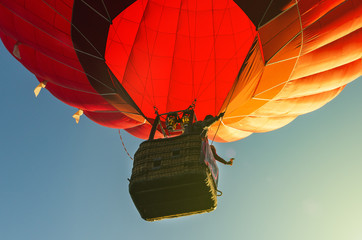 Red hot air balloon against the blue sky