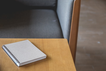 Book on table of brown, copy space