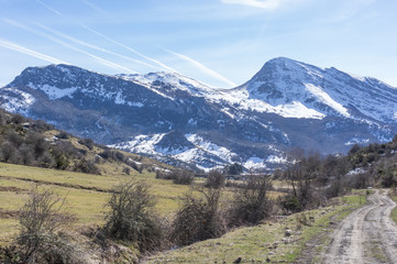 Views of the snowy mountains, near Buron in Leon, Spain. You can see the path used for the excursions in the valley.