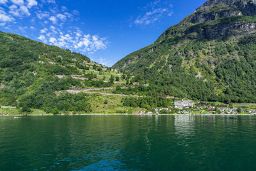 Naklejka na ściany i meble The Eagle Road, a serpentine road from Geiranger towards Eidsdal offers a stunning panorama of Geirangerfjord, Sunnmore, More og Romsdal, Norway