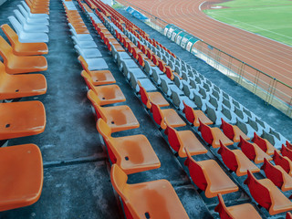 Fototapeta premium Colorful plastic seats at the stadium.