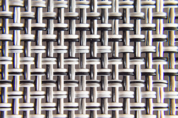 background texture of braided black and white wire close-up