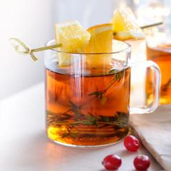 Wounderful morning with a cup of hot tea with an orange and a thyme