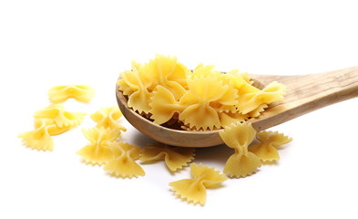 Farfalle pasta in wooden spoon isolated on white background