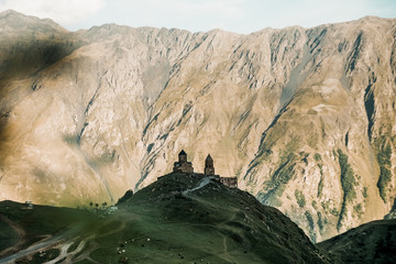 amazing landscape with old church Gergeti Triniti church in the Georgian mountains 