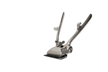 Old manual hair clipper isolated on white background