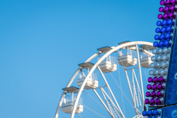 Carousel wheel detail against blue sky