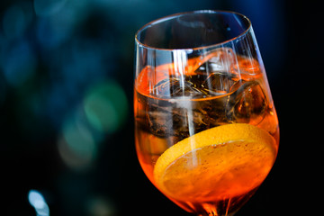 glass of whiskey and ice on black background