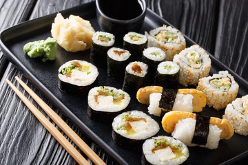 Delicious Japanese sushi rolls big set close-up on a plate. horizontal