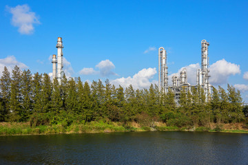 cloud movement behind petrochemical and petroleum plant with reactor and distillation for chemical process in industrial area