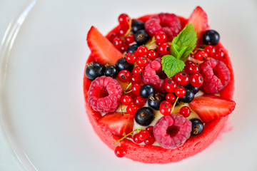 berries on a plate isolated on white