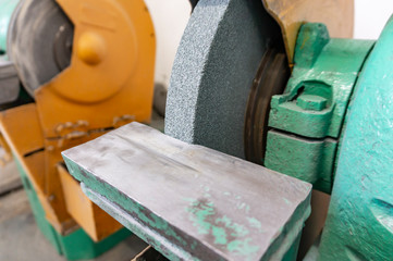 Industrial grinding machine for sharpening tools in the workshop at the enterprise.