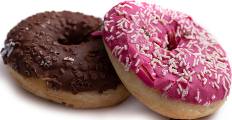 Donuts on a white background, two multi-colored donuts.