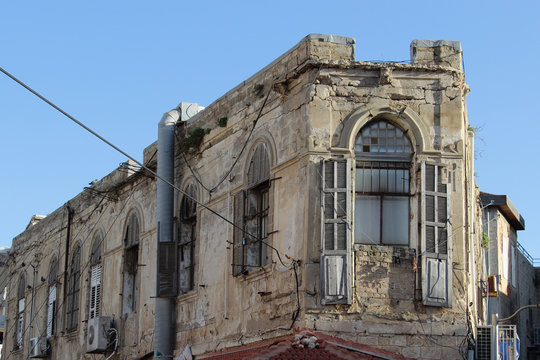Facade of very old building in entrance to ancient town in Jaffa, Israel