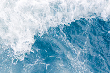 Pale blue sea wave during high summer tide, abstract ocean background