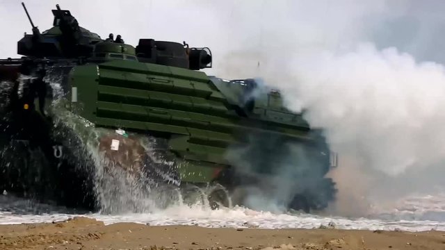 Amphibious vehicle emerging from the beach.